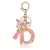 Sleutelhanger LETTER D roze met vlinder en franjes BRL328D