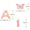 Sleutelhanger LETTER D roze met vlinder en franjes BRL328D