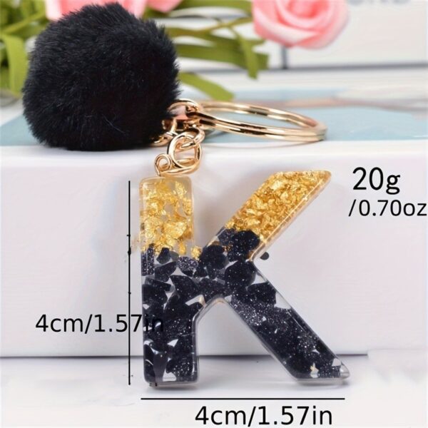 Sleutelhanger LETTER K met pompon zwart en goud BRL342K