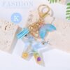 Sleutelhanger letter K zeemeerminstaart schelpen franjes BRL353K