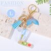 Sleutelhanger letter L zeemeerminstaart schelpen franjes BRL353L