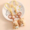 Sleutelhanger beertje met handtas beige BRL334