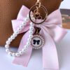 Sleutelhanger met strik en parels roze BRL362R