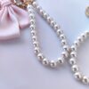 Sleutelhanger met strik en parels roze BRL362R
